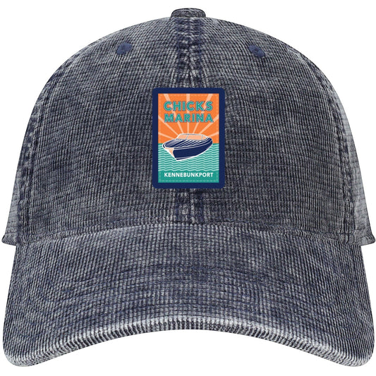 Chicks Marina salt-washed navy blue corduroy 6-panel cap with vintage-style patch logo and curved visor.