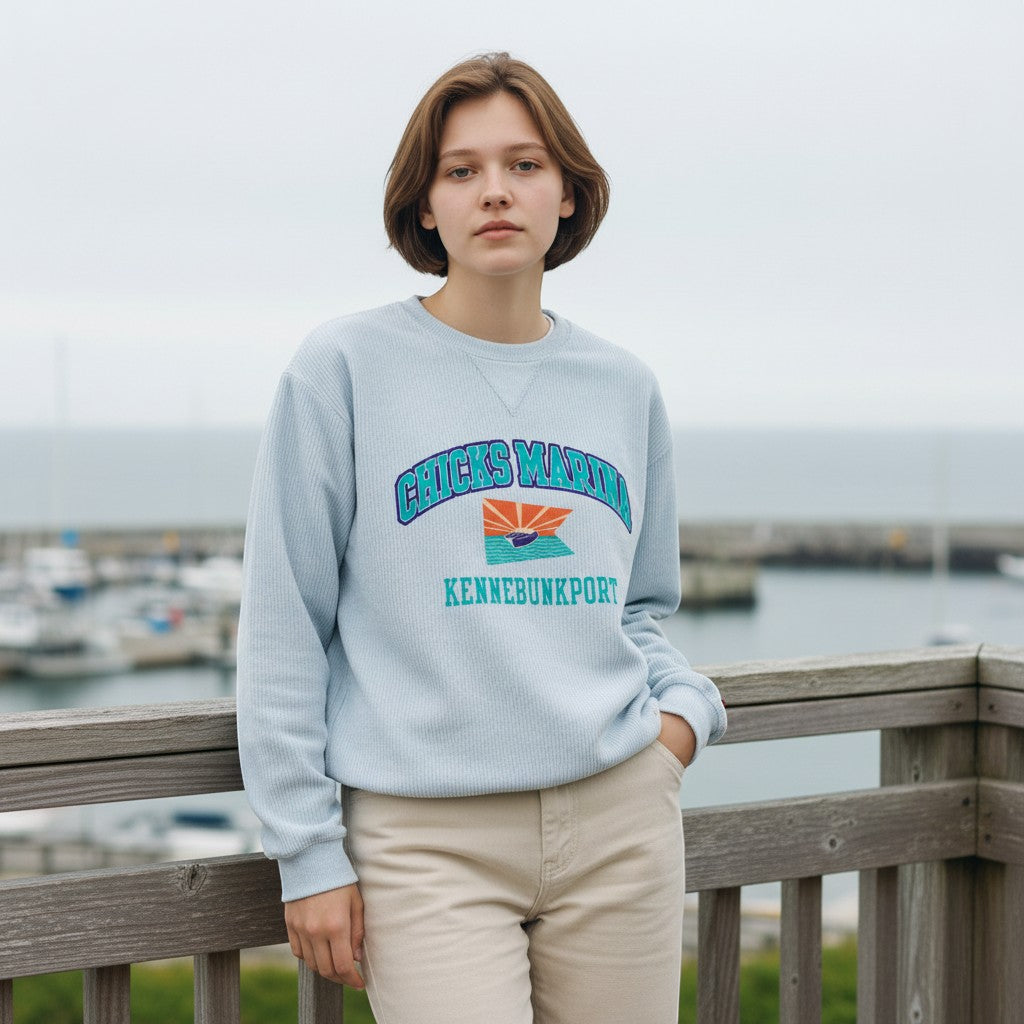 Chicks Marina light blue corduroy crewneck sweatshirt with embroidered logo and text. 100% cotton.