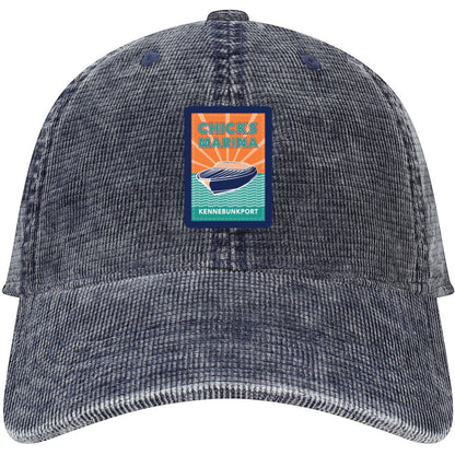 Chicks Marina salt-washed navy blue corduroy 6-panel cap with vintage-style patch logo and curved visor.